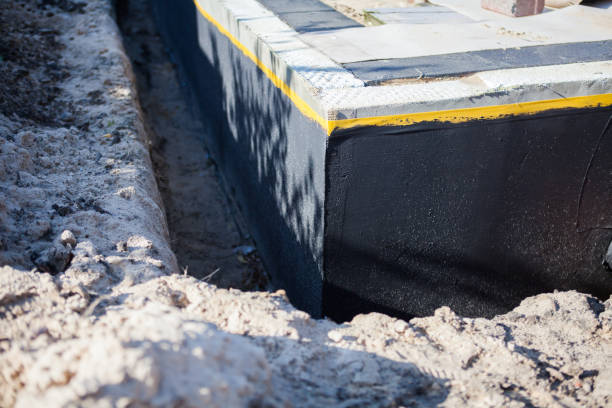 Professional Waterproofing technician working in Spring Valley, WI